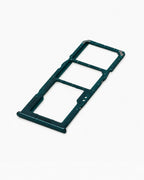 A dark teal-green plastic dual SIM tray adapter for a smartphone, shown on a clean white background.