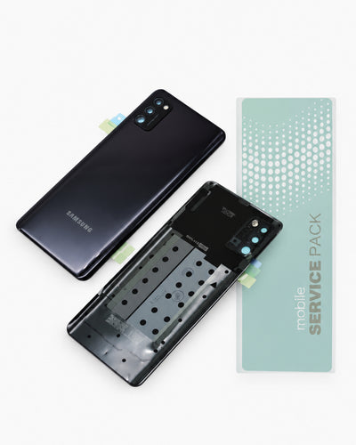 A Samsung smartphone service pack kit on a white background, showing a black Samsung phone back cover, a matching phone back cover without the rear panel, and a mint green 'mobile SERVICE PACK' card.