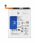 A Samsung replacement Li-ion battery with a white casing, a blue and white label, and an orange flex cable connector at the top left, shown on a plain white background.