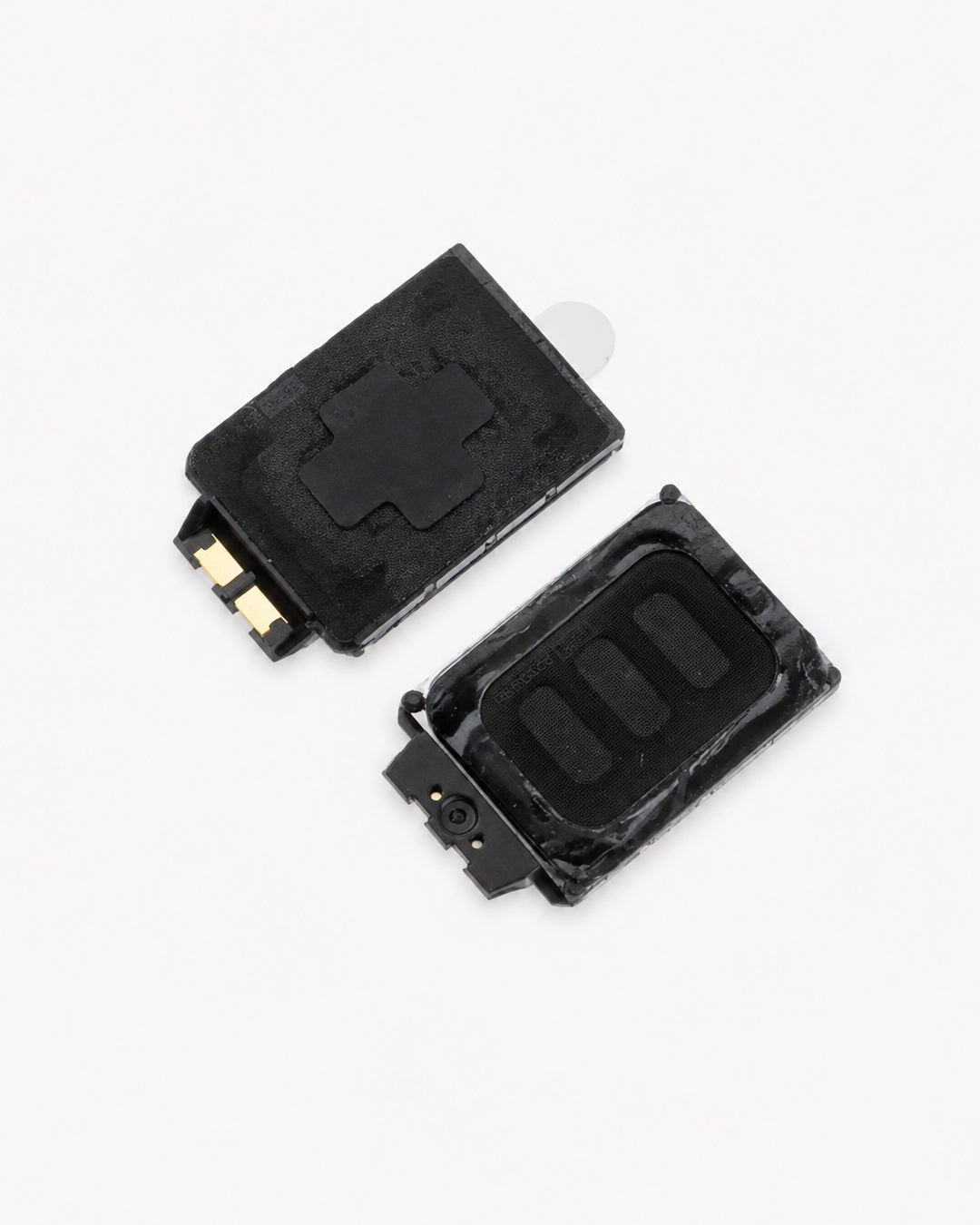 Two black replacement earpiece speaker components with gold-plated metal contacts, shown on a clean white background.