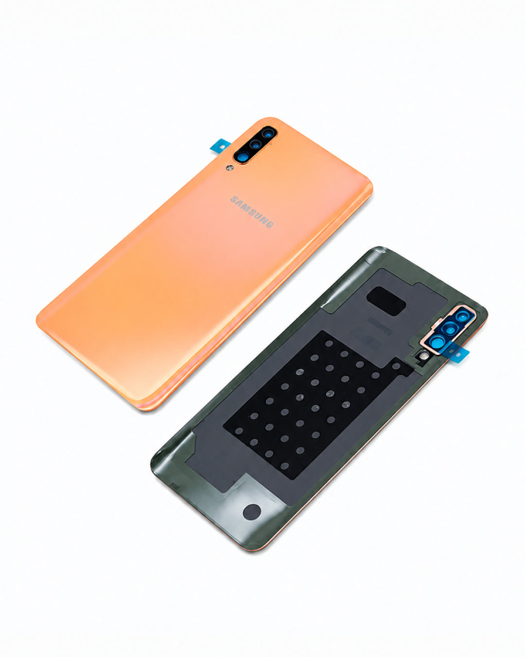 Samsung Galaxy smartphone back panel replacement parts shown on a white background, including the orange back glass and the black rear camera module with blue protective tape.