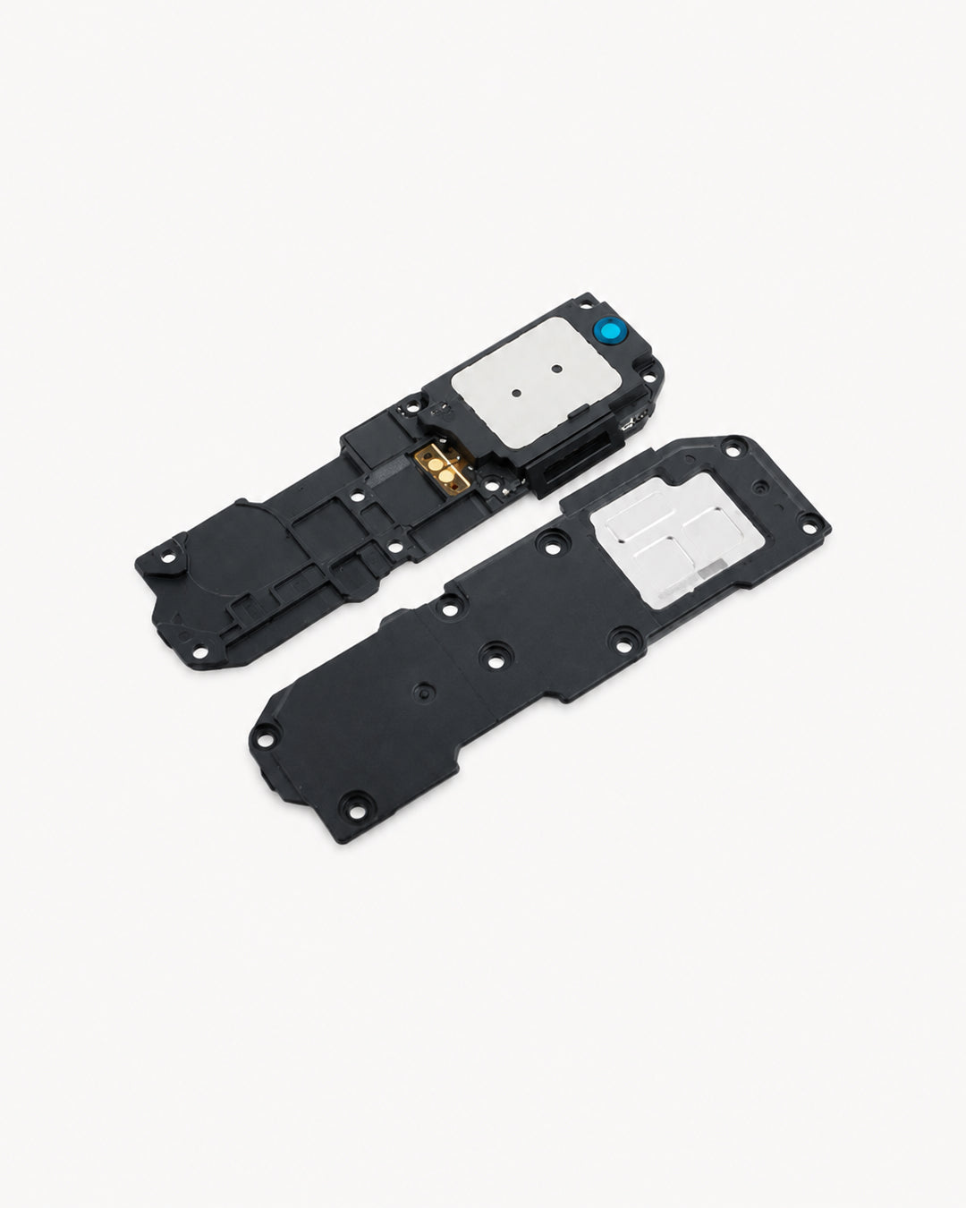 Two black plastic replacement parts with white adhesive pads and small metallic and blue accents, shown on a light off-white background.