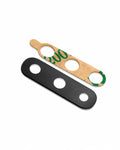 Two replacement parts for a bicycle headset: a black metal outer race with three circular holes, and a light brown cardboard inner race with three holes and green printed text, shown on a white background.