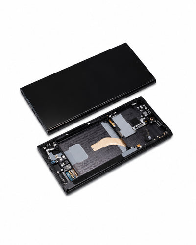 A black smartphone or electronic device shown disassembled on a clean white background, with the outer cover placed above and the internal chassis below.