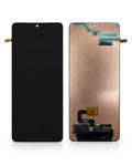 A replacement smartphone display screen and touch panel assembly, shown from both the front and back. The front view is completely black, while the back view reveals the copper-colored backplate, internal flex cables, and gold-plated contacts.