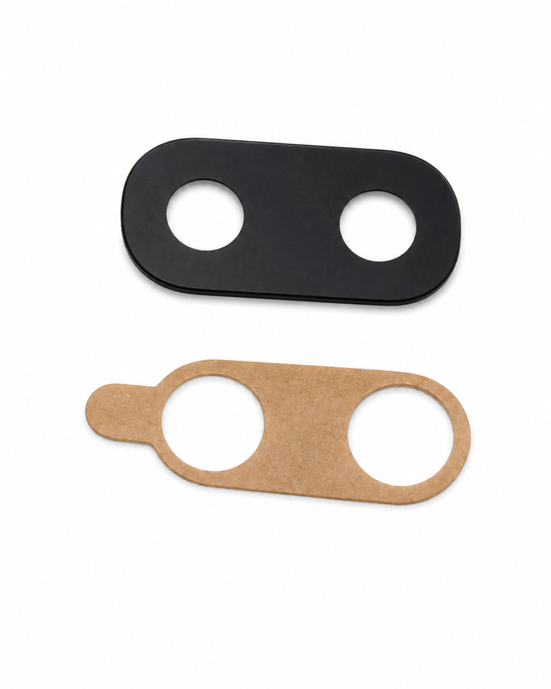 Two flat oval-shaped replacement parts with circular cutouts, shown on a plain white background. The top piece is matte black, and the bottom piece is natural tan cardboard.