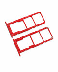 Two red plastic SIM card tray inserts for mobile phones, shown on a clean white background.