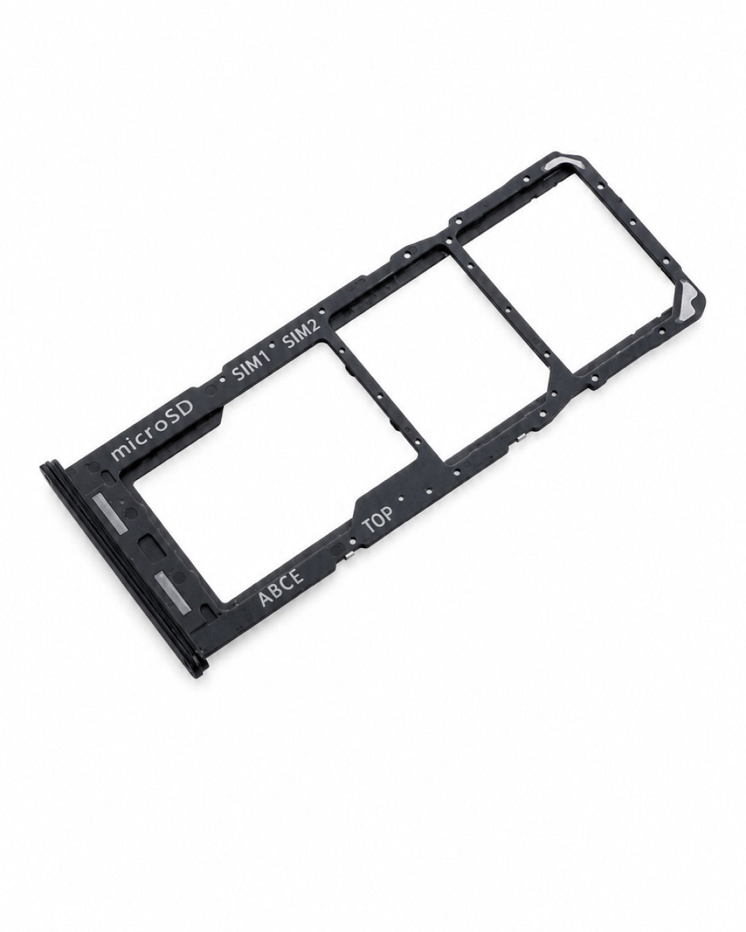 A black plastic dual SIM card tray with three card slots, featuring white printed text indicating 'microSD', 'SIM1', 'SIM2', 'TOP', and 'ASCE', shown on a plain white background.