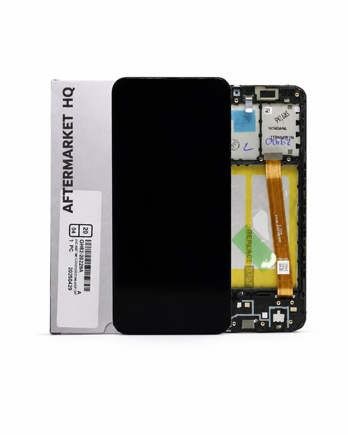 A replacement smartphone screen assembly shown next to its white 'AFTERMARKET HQ' packaging box. The screen is black and displays a blank front view, while the rear view reveals the internal circuitry, gold flex cable, and battery compartment.