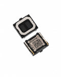 Two small black electronic components with metallic silver and gold contacts, one showing a white adhesive pad and the other a printed label with a QR code, on a plain white background.