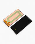 A replacement smartphone display screen assembly shown in two pieces on a white background: the front black screen panel and the rear glass panel with orange flex cables and a green protective film.